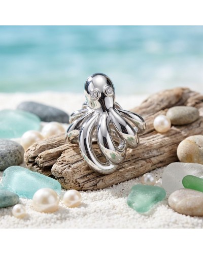Bague POULPE en argent brillant, design tentaculaire sur une plage avec pierres et perles.