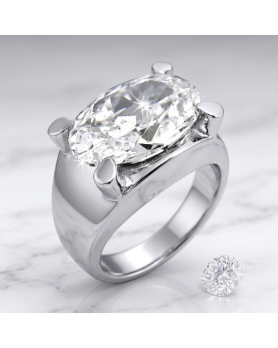 Bague NIAS en argent ou platine avec pierre centrale taille brillante et sertissage à griffes, diamant solitaire posé à côté.