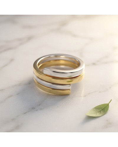 Alliance entremêlée bimatière or et argent pour homme, composante spirale sur marbre avec petite feuille verte (Alliance entrela